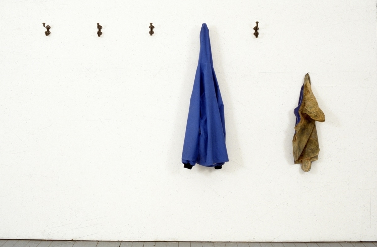 A POSE FOR A DRY PHOTOGRAPH OF RAIN_______rain jacket , latex sea turtle / 1992