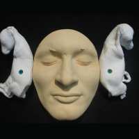 THE LISTENER_______plaster self-portrait with goats fetuses / 1999