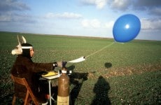 MEASURABLE LOSS OF WATER DURING A BIRDS' FLIGHT_______typing about water loss in a reclaimed landscape, littered with sea shells. the text send skyward with a helium balloon / Flevoland Netherlands / 1994