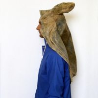A POSE FOR A DRY PHOTOGRAPH OF RAIN_______rain jacket , latex sea turtle / 1992