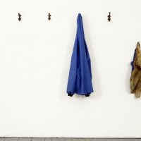 A POSE FOR A DRY PHOTOGRAPH OF RAIN_______rain jacket , latex sea turtle / 1992