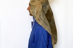 A POSE FOR A DRY PHOTOGRAPH OF RAIN_______rain jacket , latex sea turtle / 1992