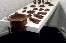 CHOCOLATE SOLILOQUY_______chocolate fetal goat casts, dried goat ears, alarm clock dipped in chocolate / 1989