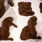 CHOCOLATE SOLILOQUY_______chocolate fetal goat casts, dried goat ears, alarm clock dipped in chocolate/ 1989