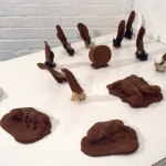 CHOCOLATE SOLILOQUY_______chocolate fetal goat casts, dried goat ears, alarm clock dipped in chocolate/ 1989
