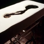 SLEEPING WITH CHOCOLATE_______autopsy table a self-contained unit, where chocolate is pumped to the surface and returns through a middle drain/ 1996