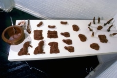CHOCOLATE SOLILOQUY_______chocolate fetal goat casts, dried goat ears, alarm clock dipped in chocolate / 1989