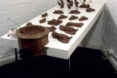 CHOCOLATE SOLILOQUY_______chocolate fetal goat casts, dried goat ears, alarm clock dipped in chocolate / 1989