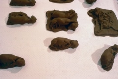CHOCOLATE SOLILOQUY_______chocolate fetal goat casts, dried goat ears, alarm clock dipped in chocolate/ 1989