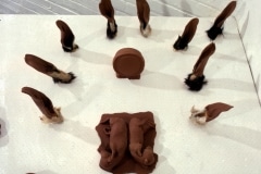 CHOCOLATE SOLILOQUY_______chocolate fetal goat casts, dried goat ears, alarm clock dipped in chocolate/ 1989