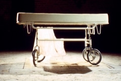 SLEEPING WITH CHOCOLATE_______autopsy table a self-contained unit, where chocolate is pumped to the surface and returns through a middle drain / 1996