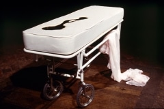 SLEEPING WITH CHOCOLATE_______autopsy table a self-contained unit, where chocolate is pumped to the surface and returns through a middle drain/ 1996