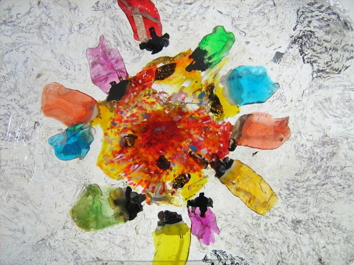 ZIPPO FLOWER AND DEFORMATION OF SACRED WORDS_______melted & pressed plastic with sacred texts inscriptions / 50X1cm / 2012