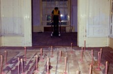 REPEATED BLOWS EVENTUALLY DRIVES ALL ANIMALS TO PASTURE_______Life-jacket, shoes, flamingo leg candles / Fodor Museum Amsterdam The Netherlands / 1992