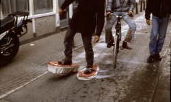 SNOWSHOES_______ an ongoing performance, snowshoes containing white flour are leaving marks while walking in different cities / AMSTERDAM / 1993 —