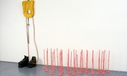 REPEATED BLOWS EVENTUALLY DRIVES ALL ANIMALS TO PASTURE_______Life-jacket, shoes, flamingo leg candles / Fodor Museum Amsterdam The Netherlands / 1992