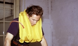 REPEATED BLOWS EVENTUALLY DRIVES ALL ANIMALS TO PASTURE_______Life-jacket, shoes, flamingo leg candles / Fodor Museum Amsterdam The Netherlands / 1992