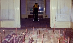 REPEATED BLOWS EVENTUALLY DRIVES ALL ANIMALS TO PASTURE_______Life-jacket, shoes, flamingo leg candles / Fodor Museum Amsterdam The Netherlands / 1992
