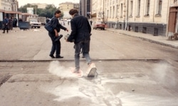 SNOWSHOES_______an ongoing performance, snowshoes containing white flour are leaving marks while walking in different cities / MOSCOW / 1993 —